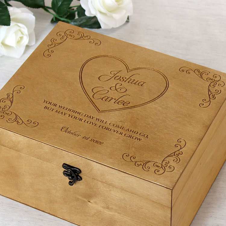 Handcrafted wooden wedding keepsake box with a personalized heart engraving for Joshua and Carlee. Features a smooth lacquered finish and vintage metal clasp, perfect for storing marriage mementos and romantic souvenirs.