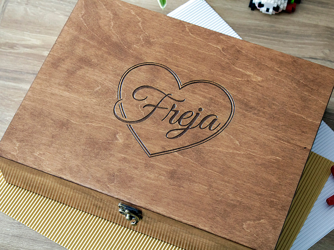Custom engraved wooden keepsake box with a heart design and personalized name Freja