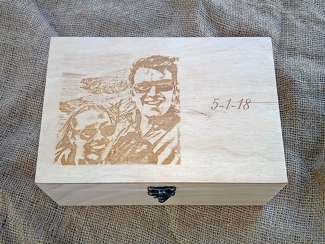 Custom laser engraved wooden memory box with personalized couple photo and wedding date on a rustic burlap background