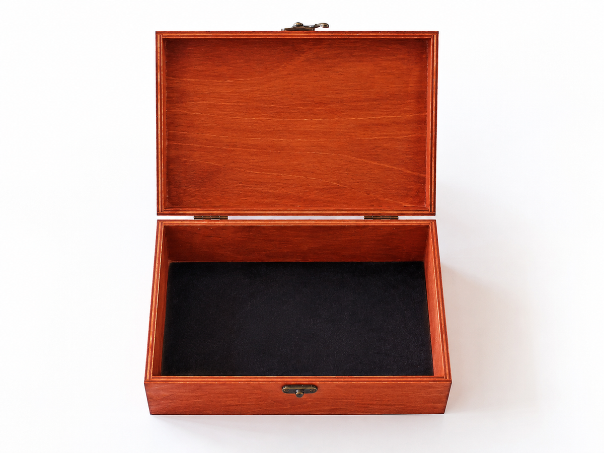 An open rectangular wooden presentation box mahogany wood finish and a black velvet-lined interior, shown on a plain white background.