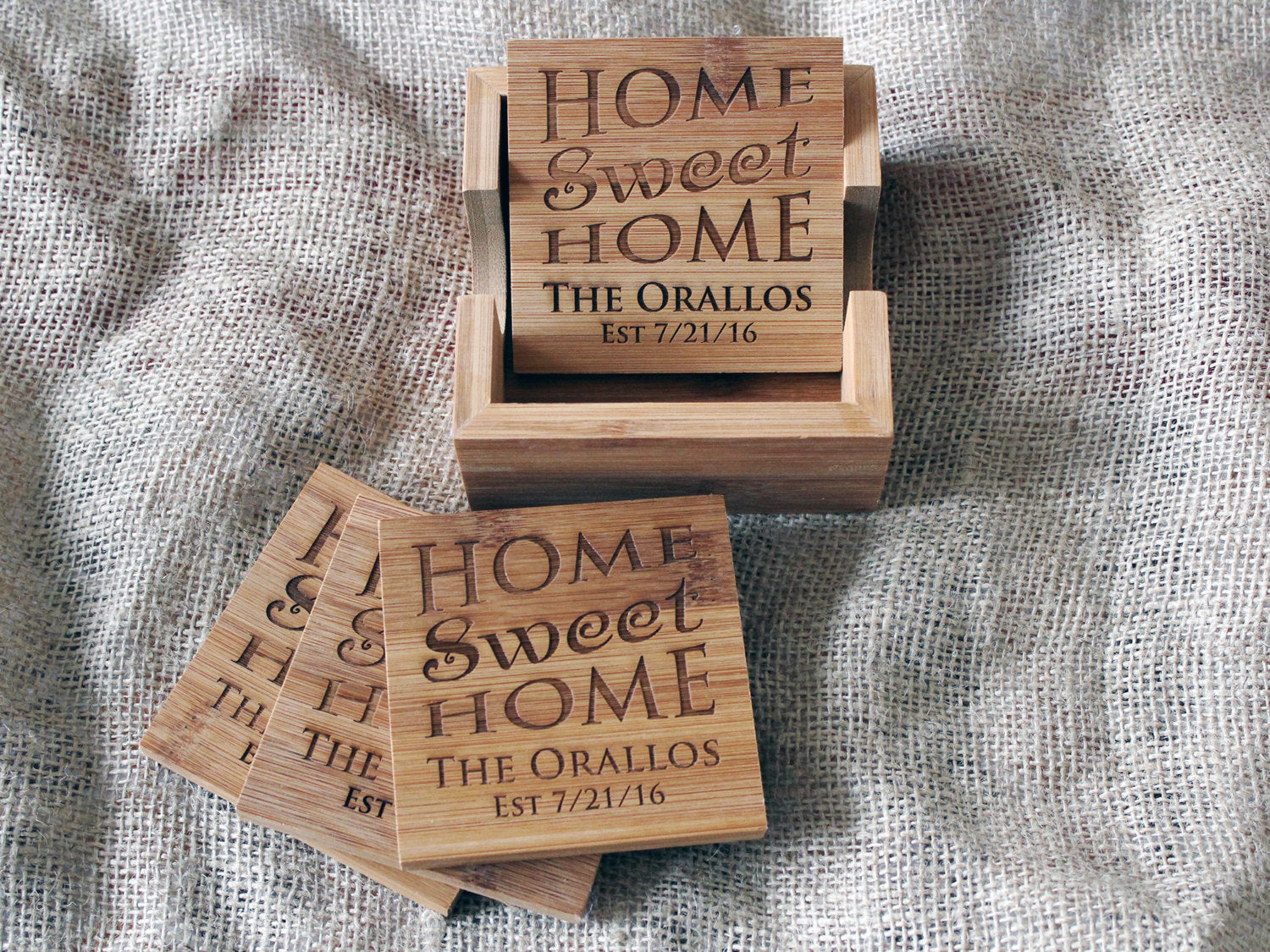 Close-up of custom engraved bamboo coaster featuring Home Sweet Home design