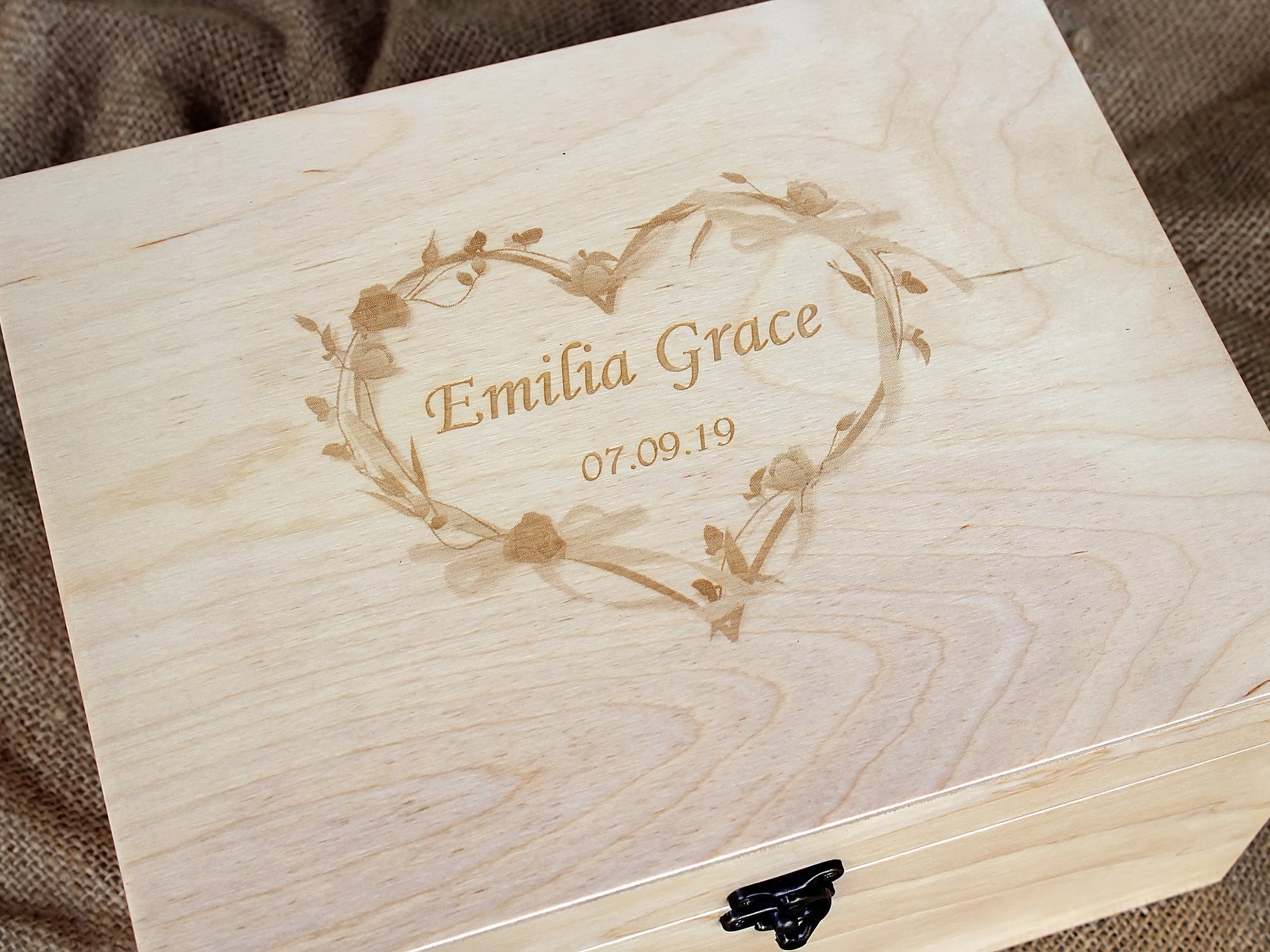 Close-up of a personalized memory box with custom laser engraving