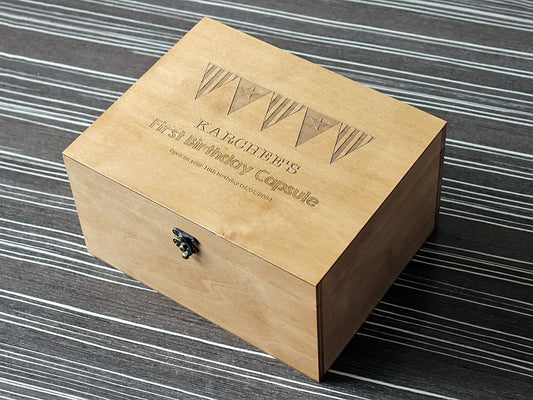 Personalized wooden time capsule box with custom engraved design