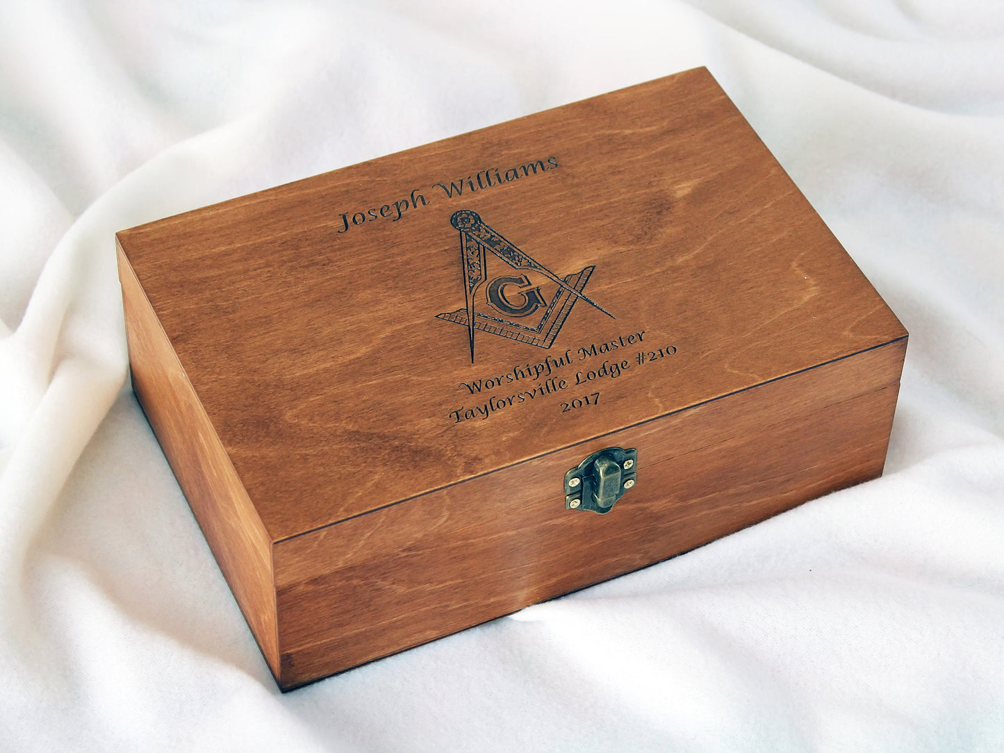 Custom logo engraved wooden box shown from an angle