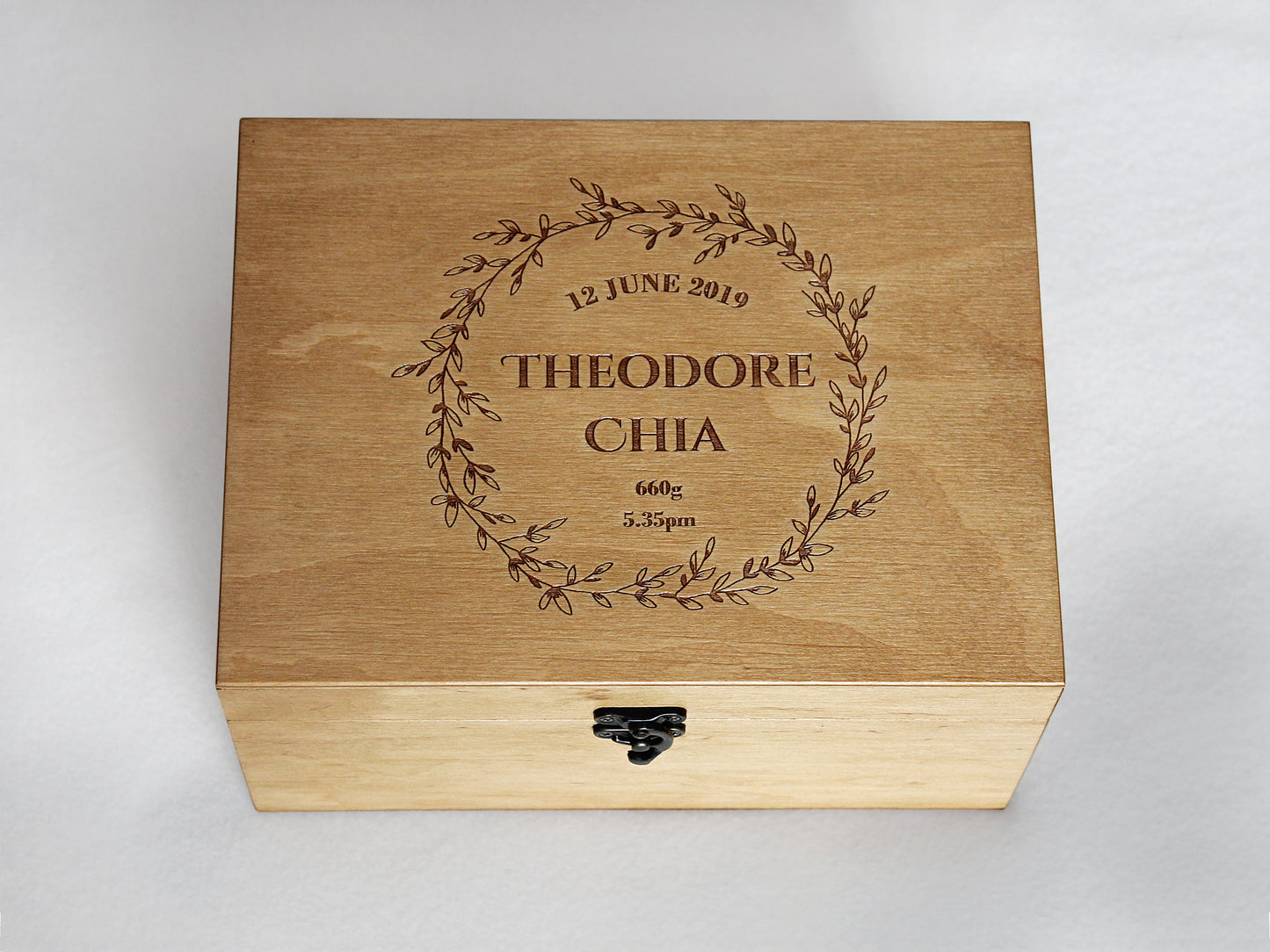 Custom engraved wooden baby keepsake box with floral wreath design