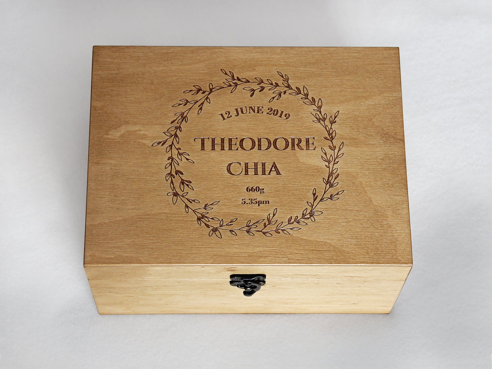 Custom engraved wooden baby keepsake box with floral wreath design
