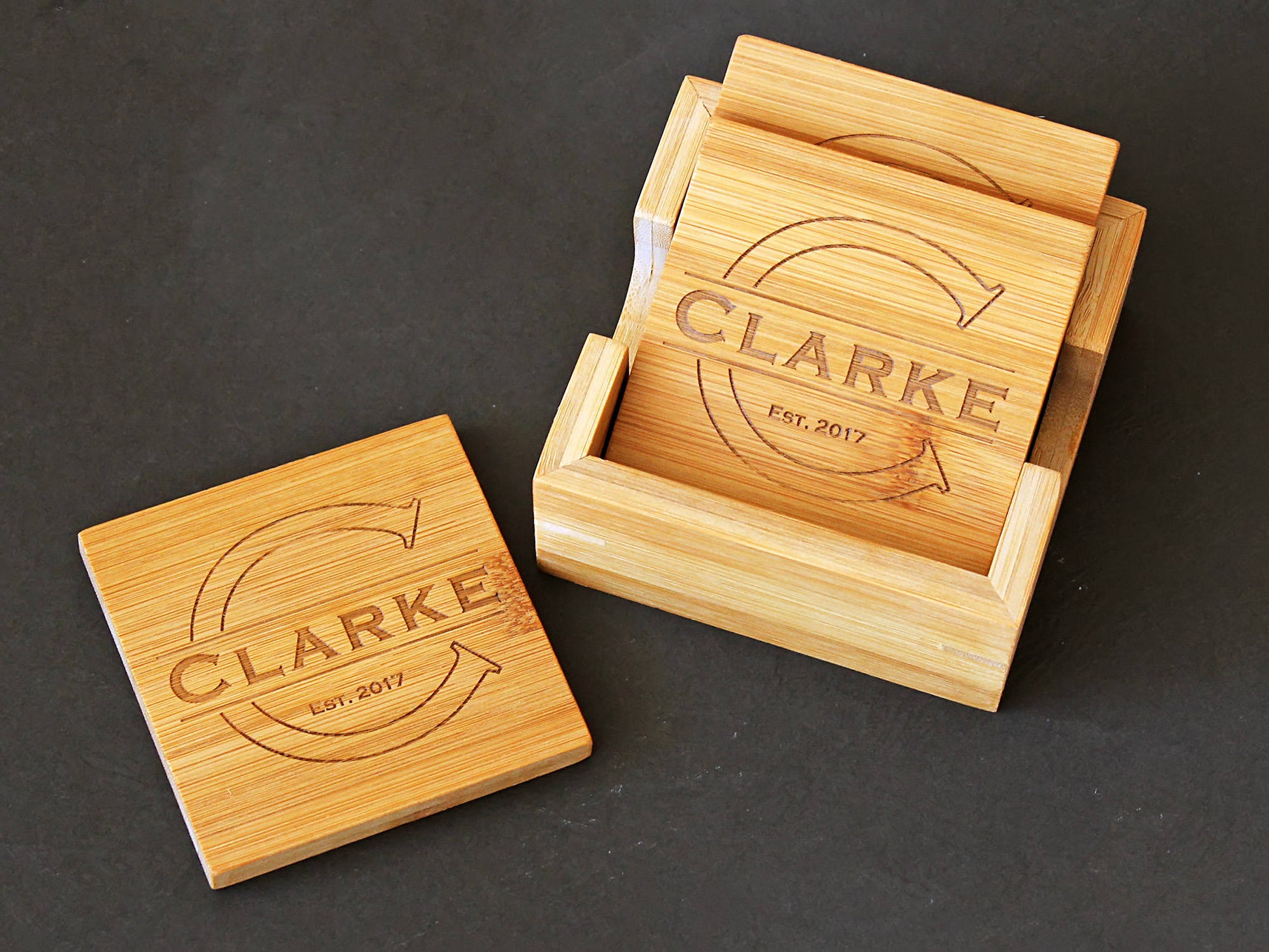 Set of four 4-inch bamboo coasters with custom monogram designs