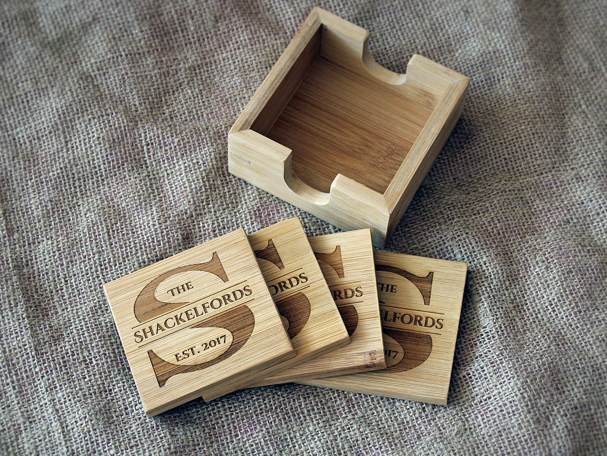 Set of four personalized monogram bamboo coasters with matching holder