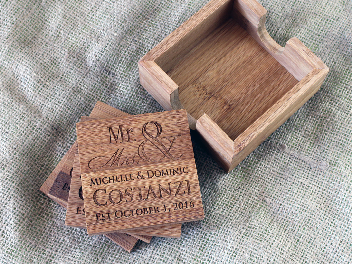 Four piece bamboo coaster set with personalized engraved designs