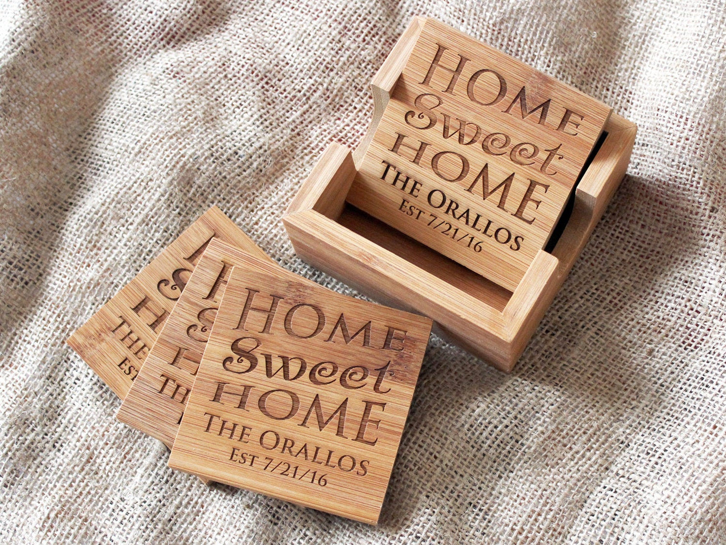 Personalized bamboo coasters engraved with family name and Home Sweet Home design