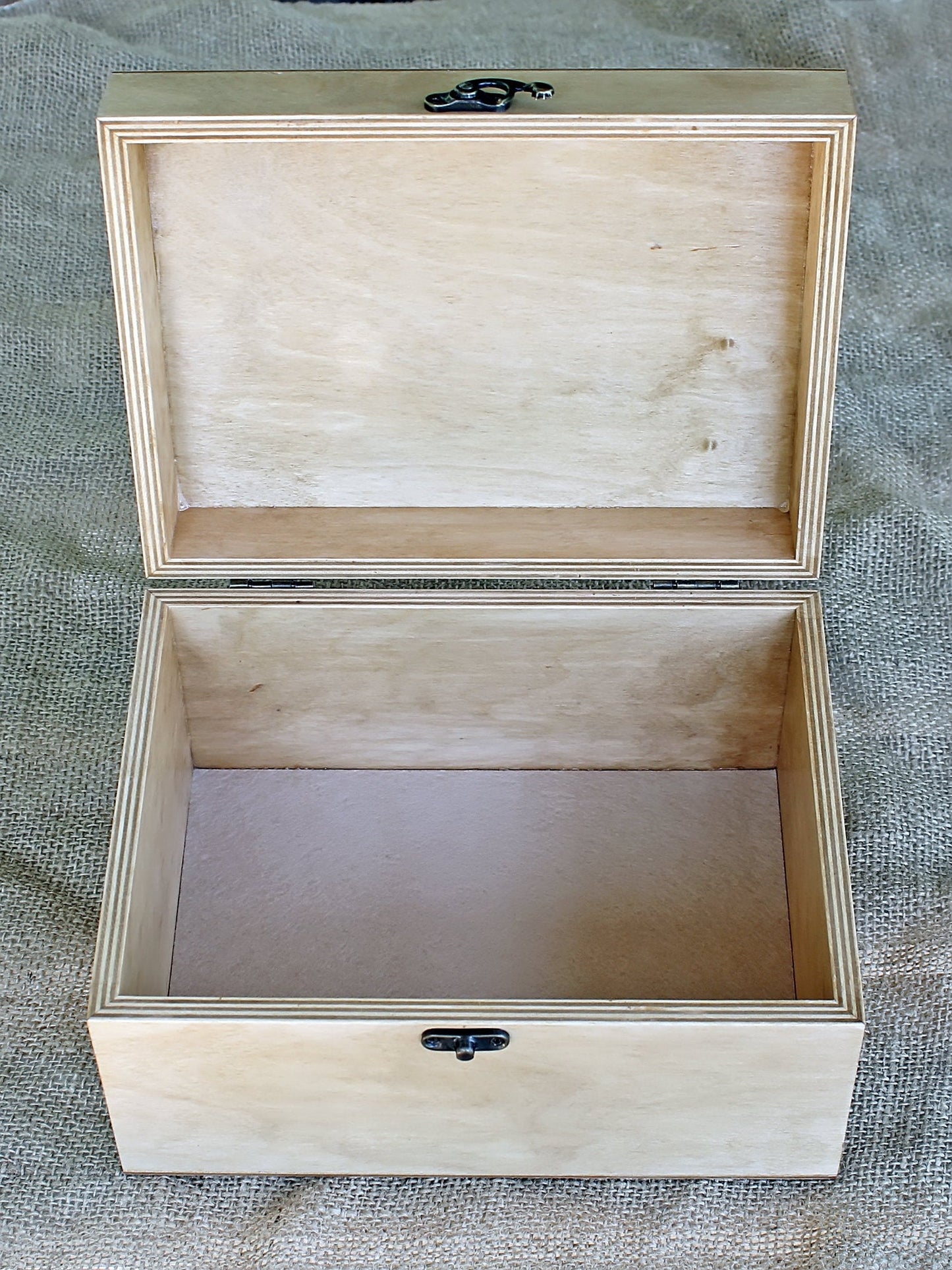 An opened up memory gift box with inside bottom padding