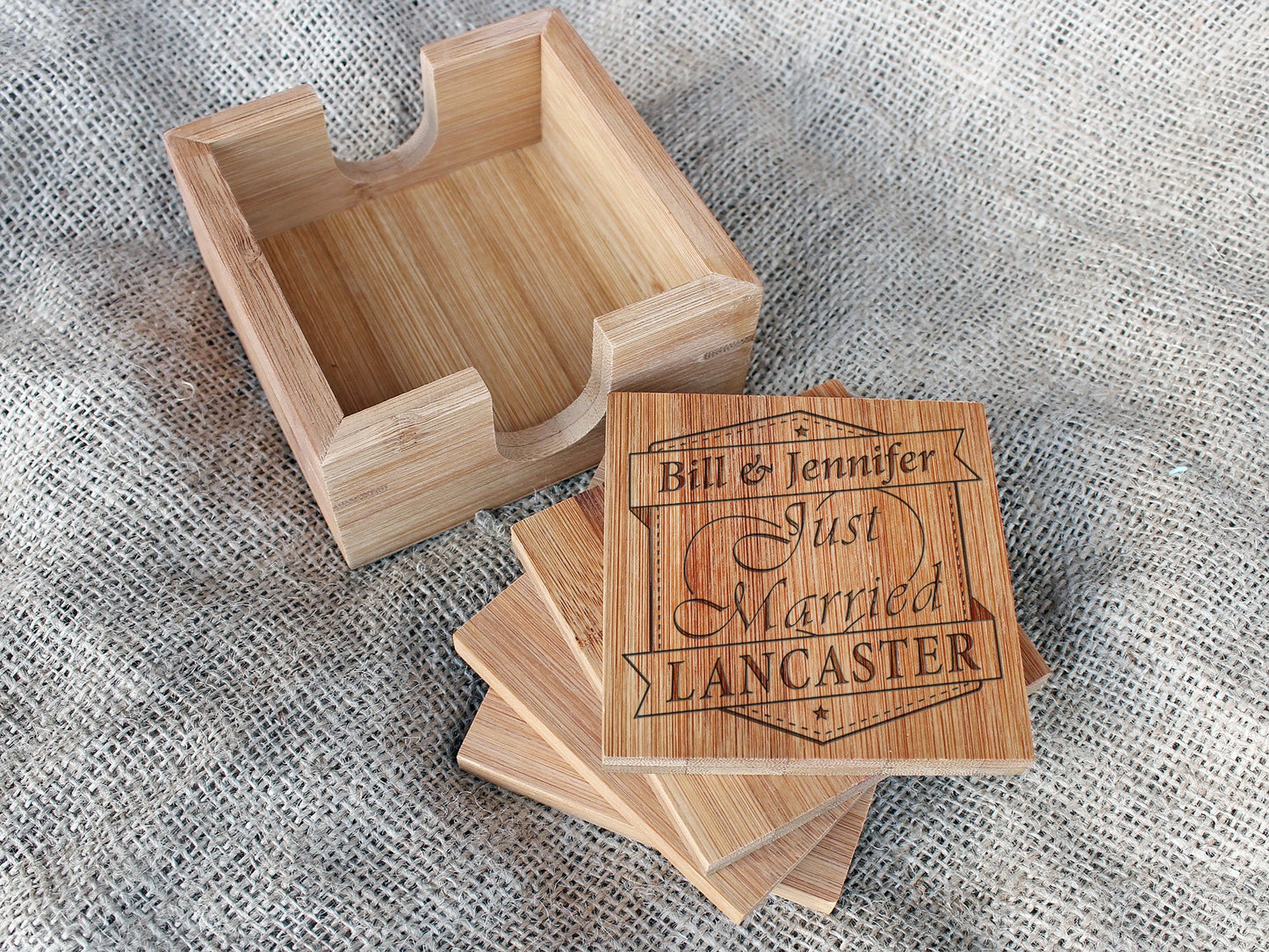 Personalized bamboo coaster set with custom engraved design and matching holder