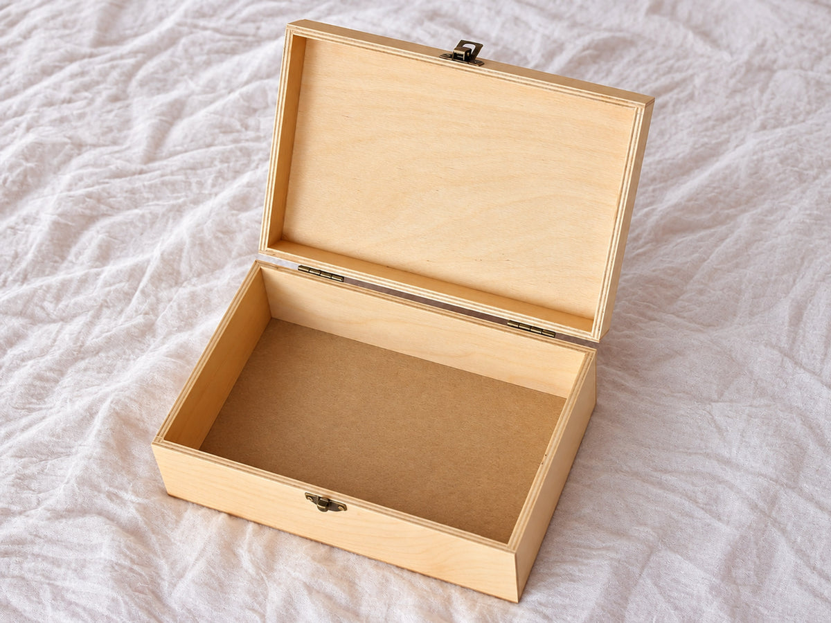 Open personalized wooden jewelry box showing spacious interior