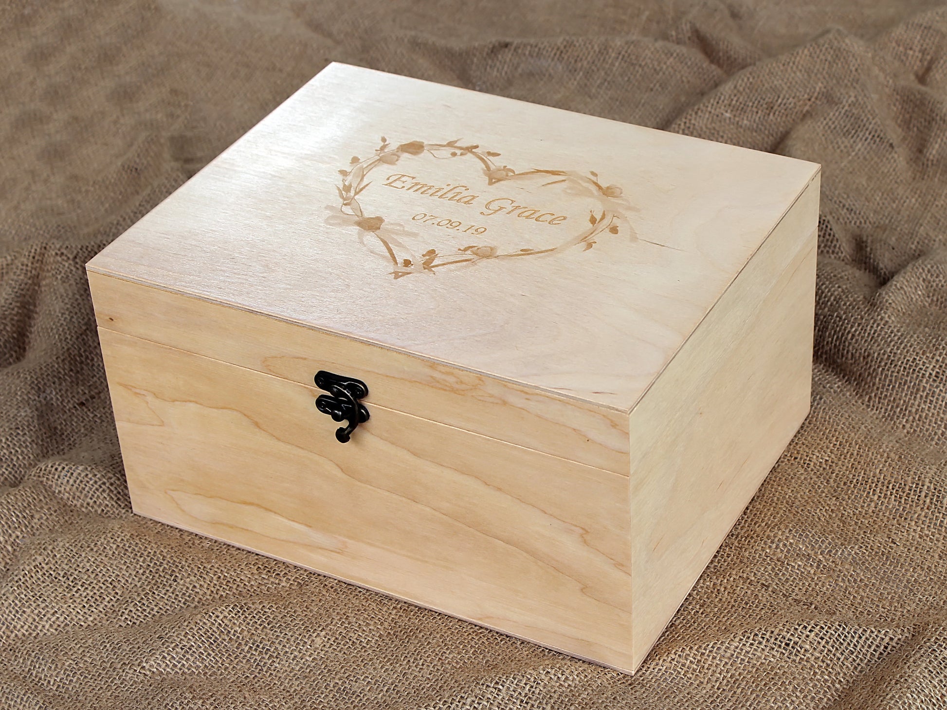 Personalized wooden memory box engraved with a custom name and floral design