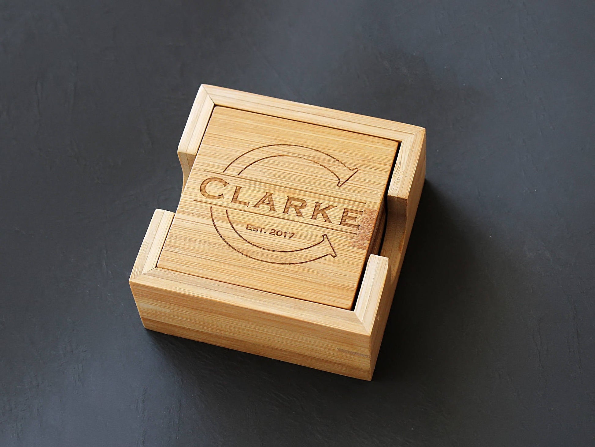 Close-up of a personalized bamboo coaster with custom monogram engraving