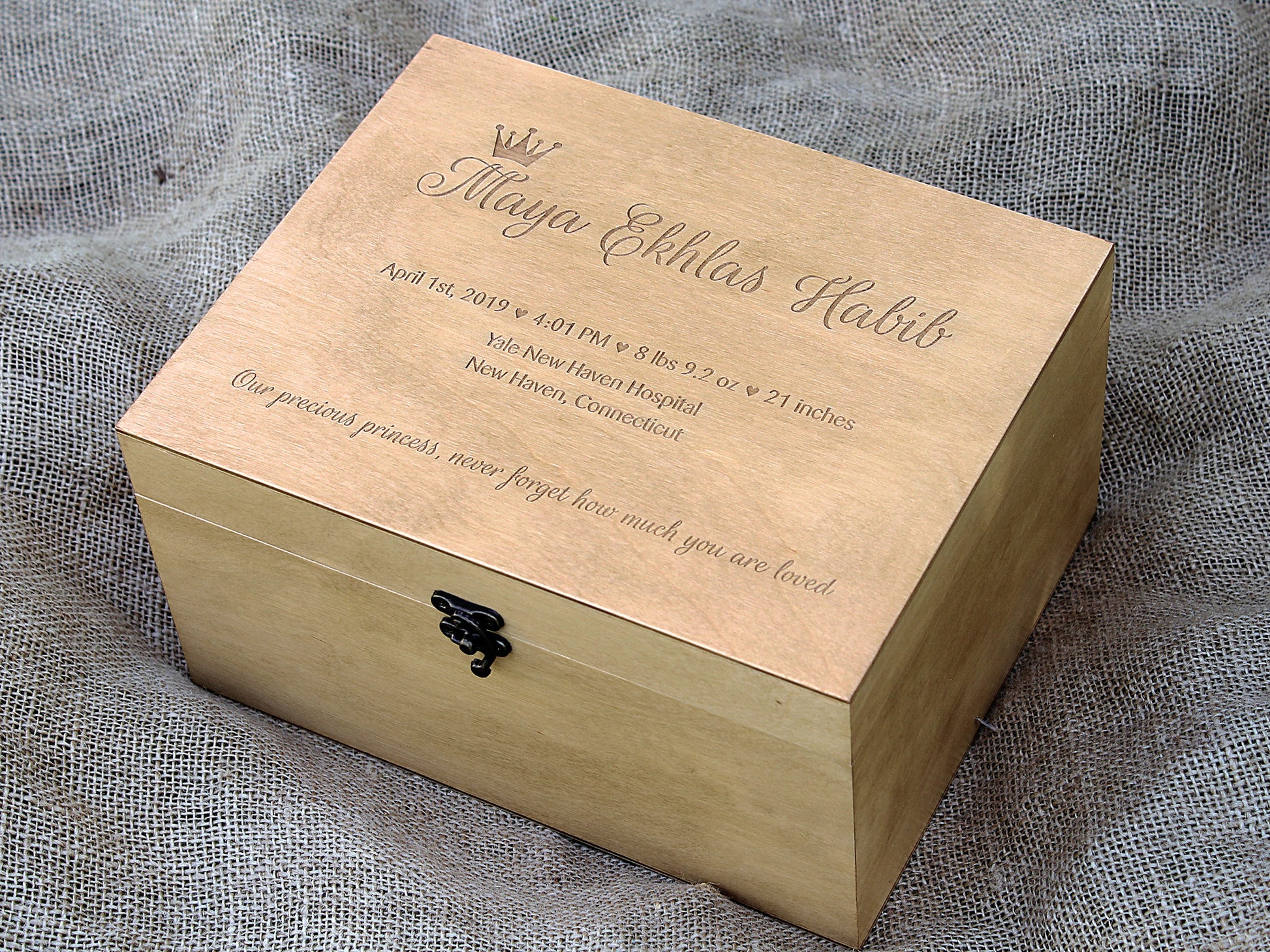 Personalized wooden memory box for preserving a baby girl's precious keepsakes