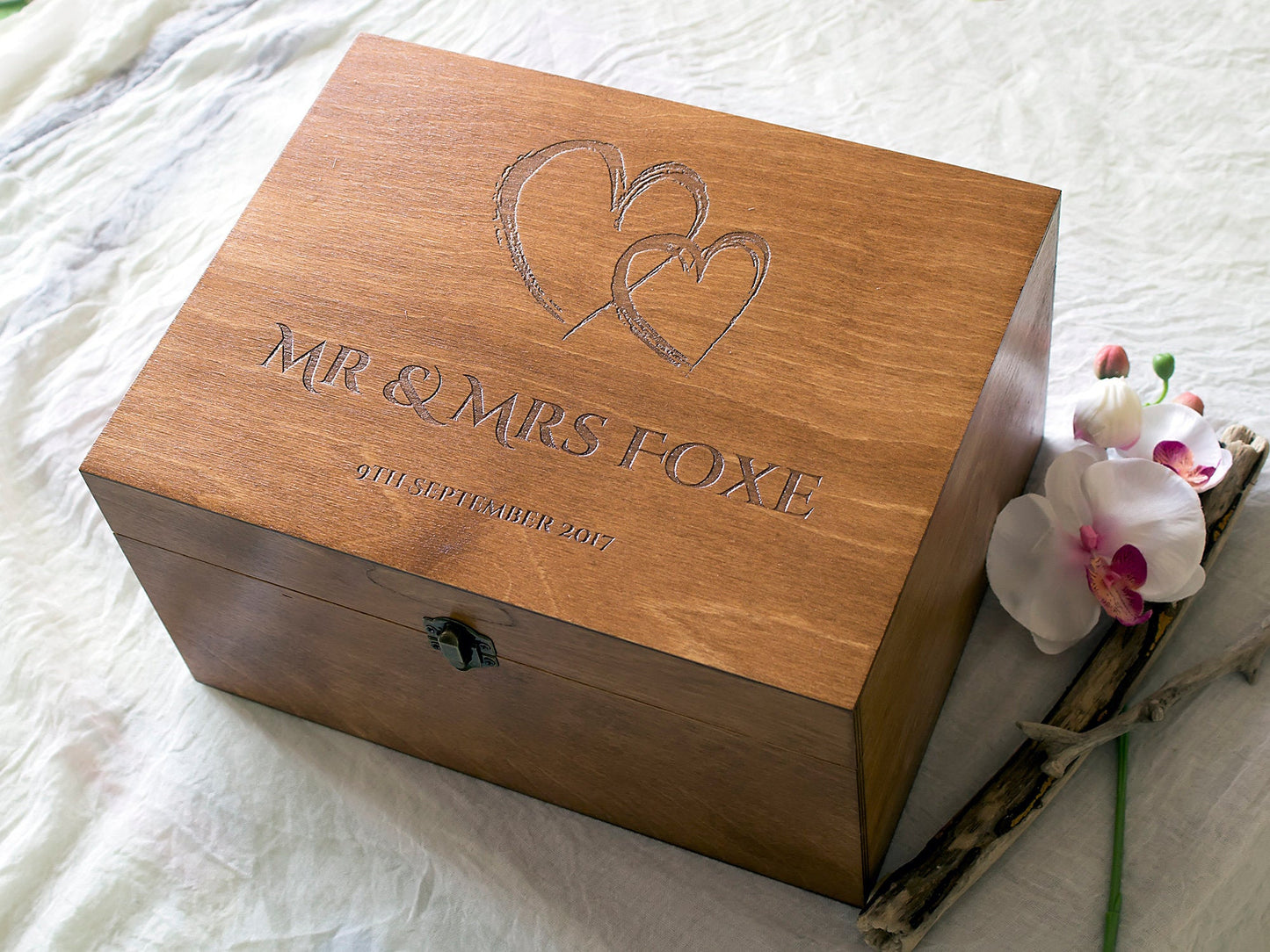 Personalized wedding memory box with engraved names and interlocked hearts design