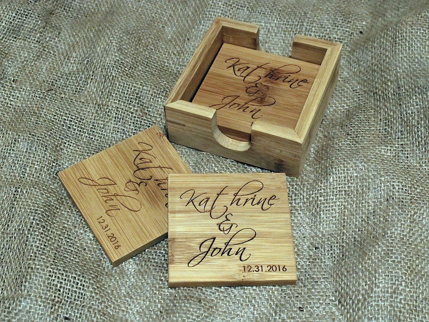 Custom engraved bamboo coasters prepared for a wedding event