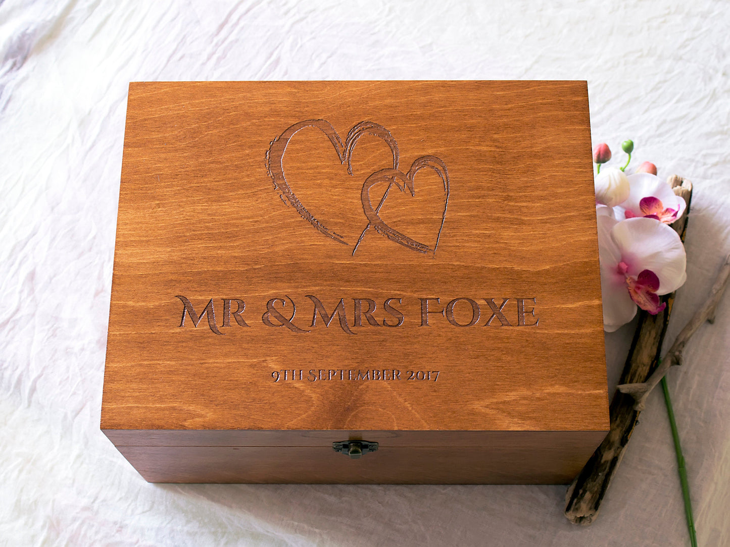 Wooden wedding memory box featuring interlocked hearts engraving