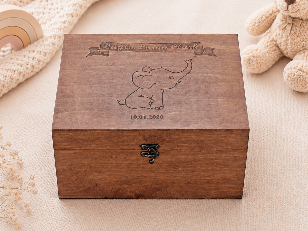 Laser-engraved elephant illustration on a personalized wooden baby memory box